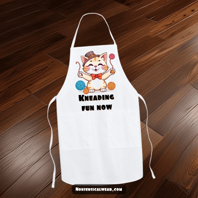 Funny apron depicting a dapper, smiling cat wearing formal attire and juggling yarn balls, adding charm to cooking.