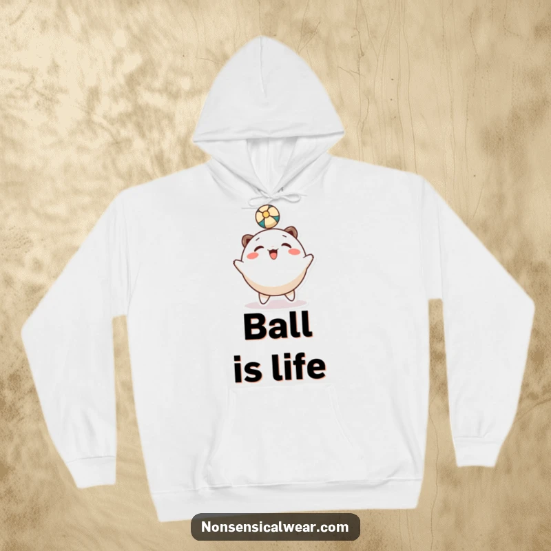 Funny hoodie: a happy, round character is shown gleefully bouncing a ball with its head.