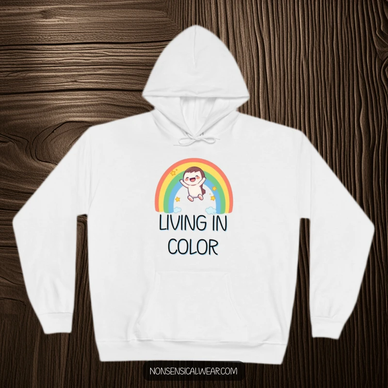 Funny hoodie: a happy character slides down a magical rainbow, with stars twinkling in the background.