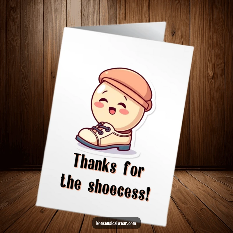 Funny Free Printable Thank You Card: A giggling button humorously tries on a tiny hat as shoes, expressing thanks with delight.