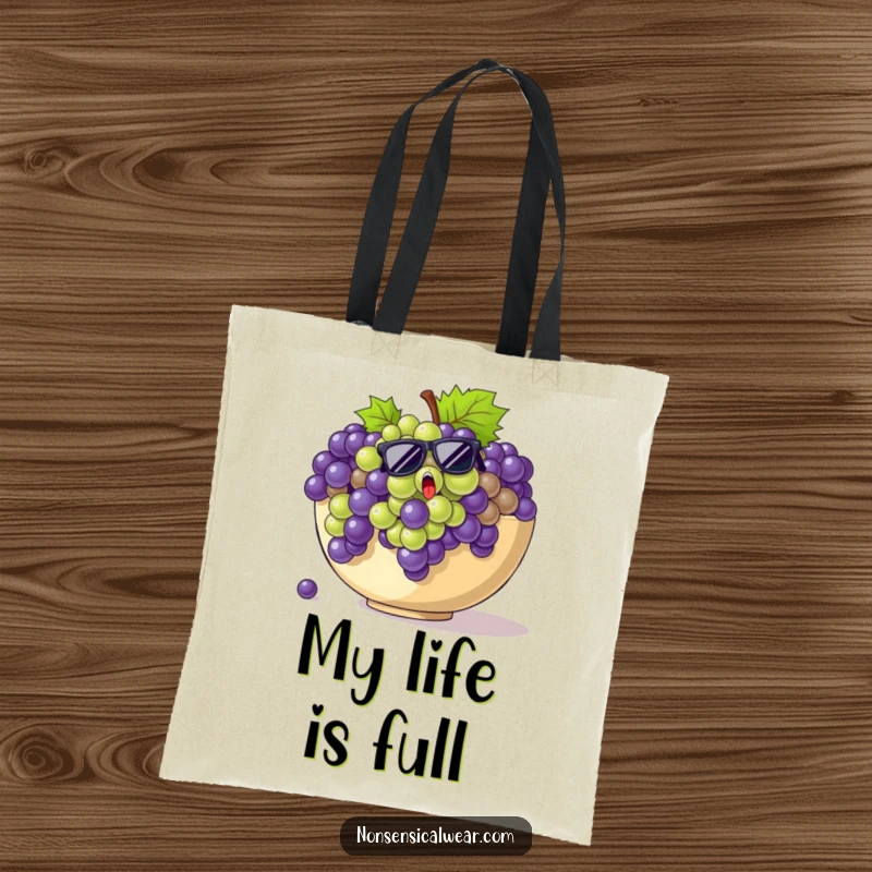 Funny grapes tote bag illustration of startled grapes in sunglasses breaking out of a giant fruit bowl.